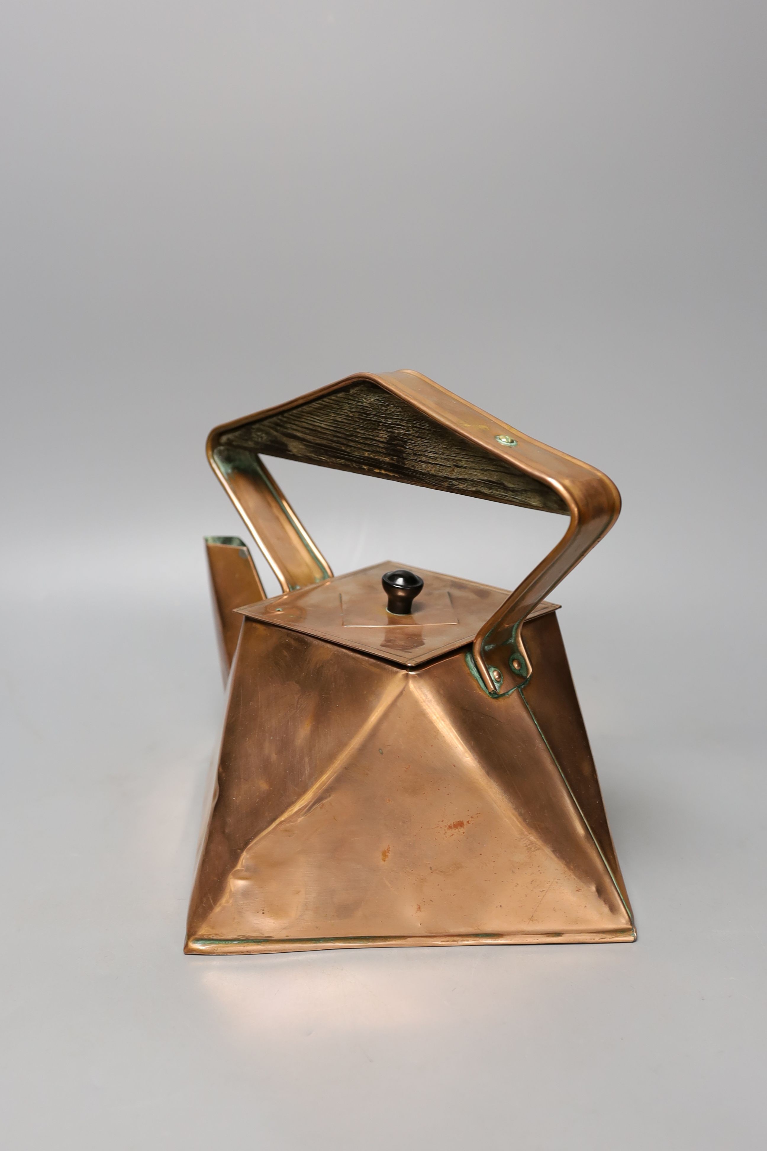 An Arts & Crafts geometric copper kettle, 23cm high, *This lot is being sold in aid of the charity Dogs Trust UK with 100% of the hammer price going to the charity